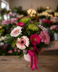 Bouquet of flowers with pink and green colors on a white background