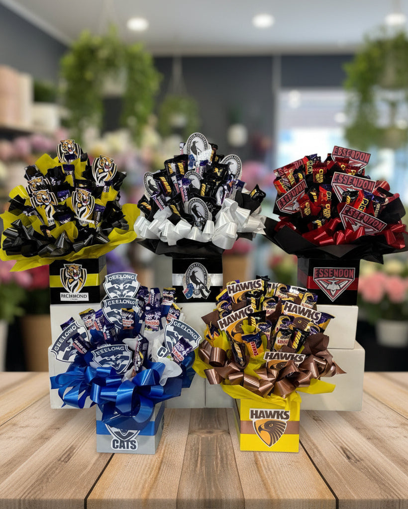Assorted candy bouquets with sports team logos on a white background