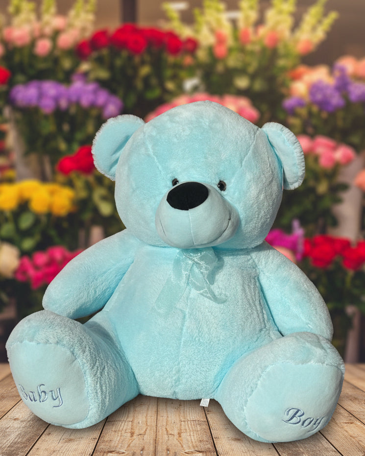 Light blue teddy bear on a white background